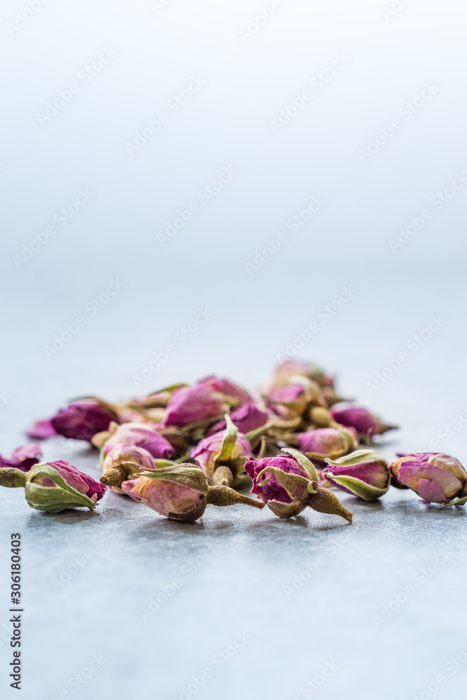 Dry Tea Rose Buds on Granite Surface. Dry Tea Rose Buds on Granite Surface.