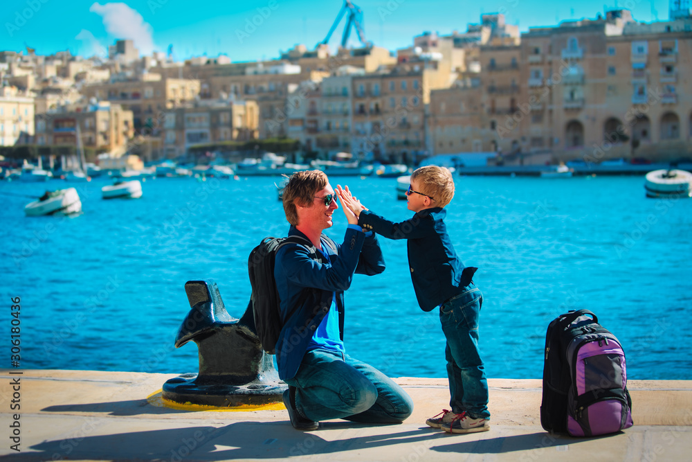 father and little son high five on the quay of Malta, Europe