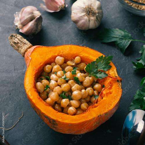 Curry chickpeas baked in a plate of hokkaido pumpkin. photo