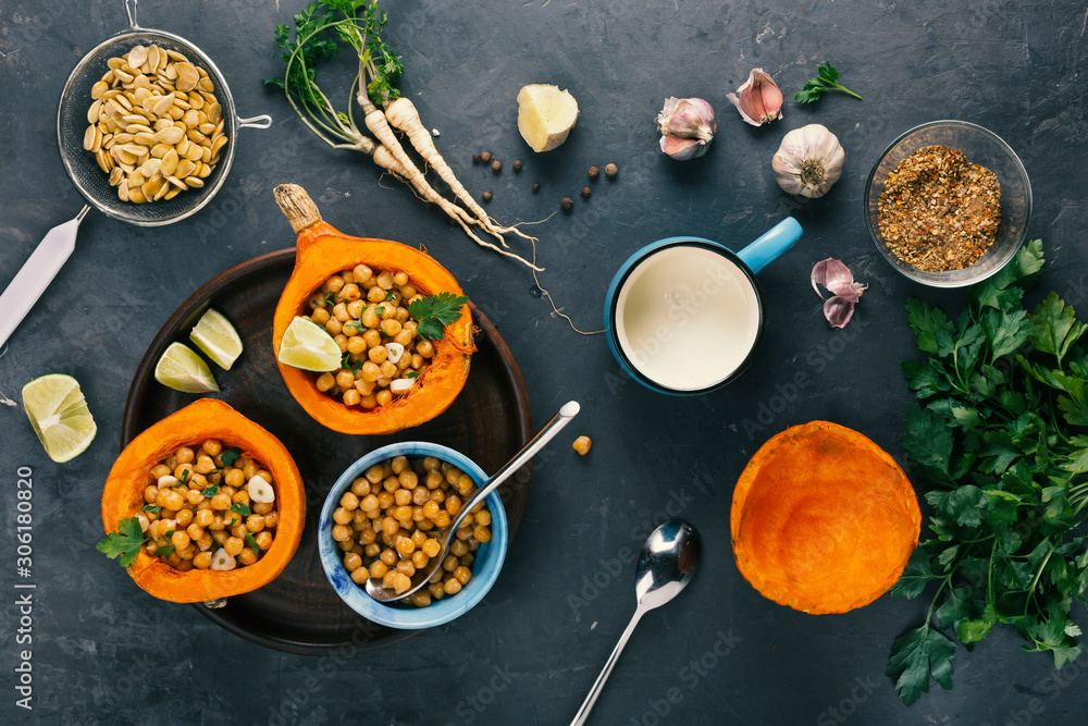 Recipe for baked pumpkin with chickpea curry, cilantro and herbs.