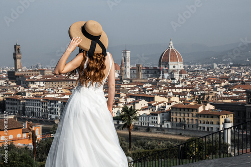 Bride with a hat on Michelangelo Square, Florence