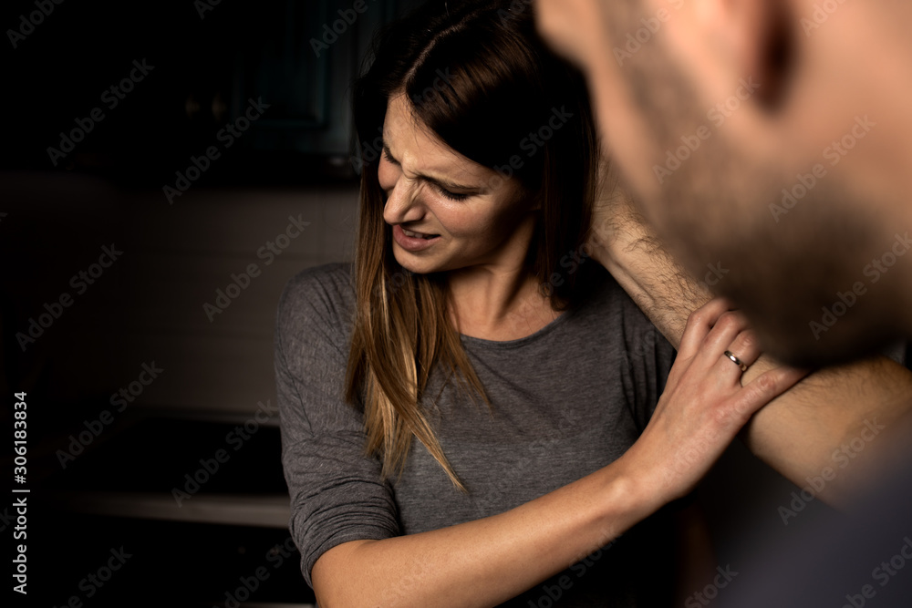 Sexual abuse with a man attacking to a scared woman in a dark place Sexual abuse with a man attacking to a scared woman in a dark place
