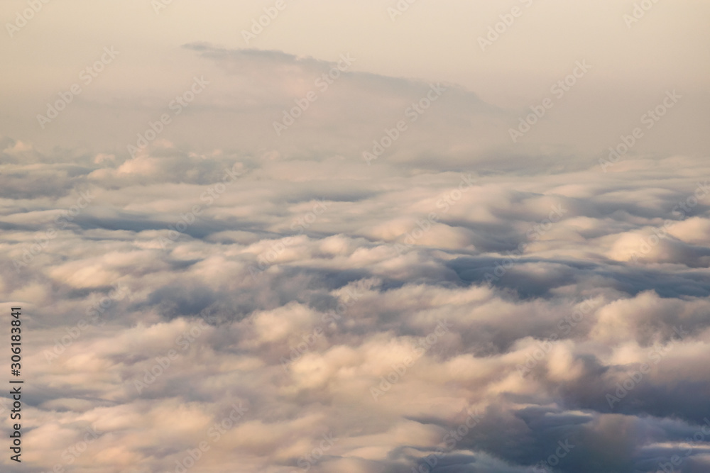 Clouds seen from above on sunrise texture Clouds seen from above on sunrise texture