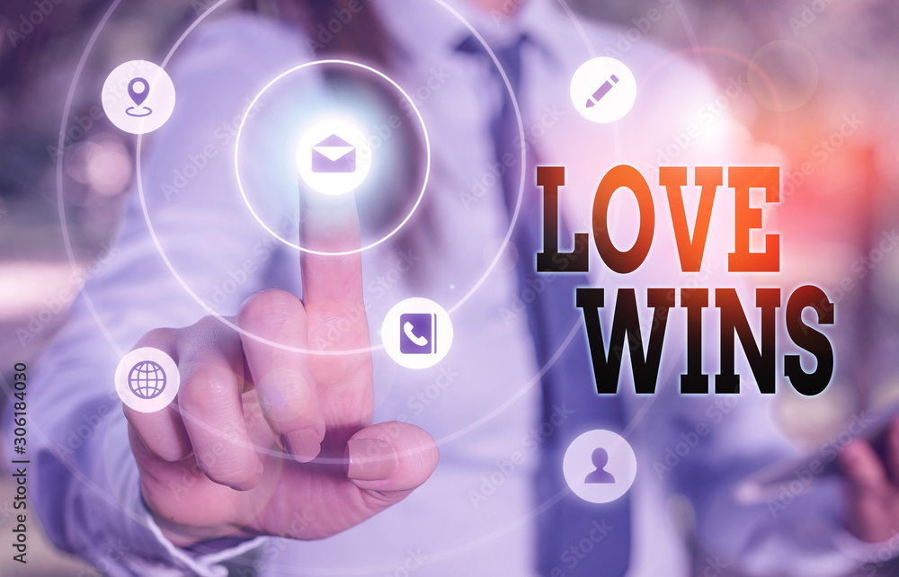 Writing note showing Love Wins. Business concept for used to celebrate or commemorate the victory of marriage equality Writing note showing Love Wins. Business concept for used to celebrate or commemorate the victory of marriage equality