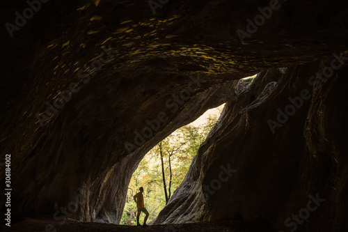 Man silhouette in rocky cave