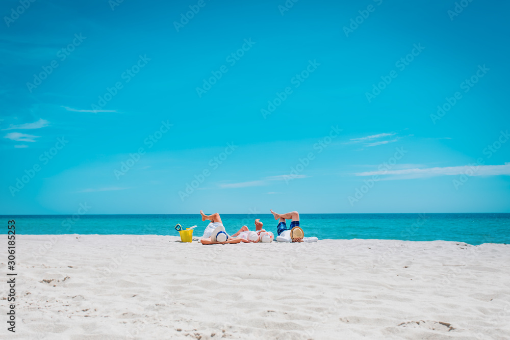 happy family with kids relax on tropical beach vacation happy family with kids relax on tropical beach vacation