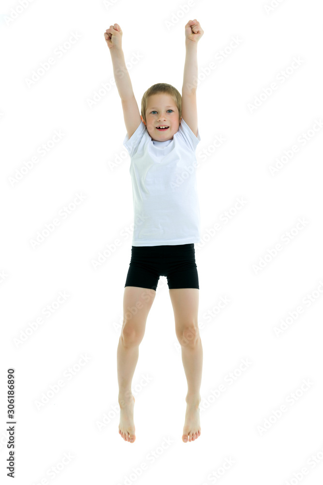 A little boy in a clean white T-shirt is jumping fun. A little boy in a clean white T-shirt is jumping fun.