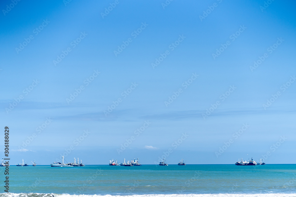 Obraz premium Fishing port of Manta, Ecuador, early in the morning, blue sky.