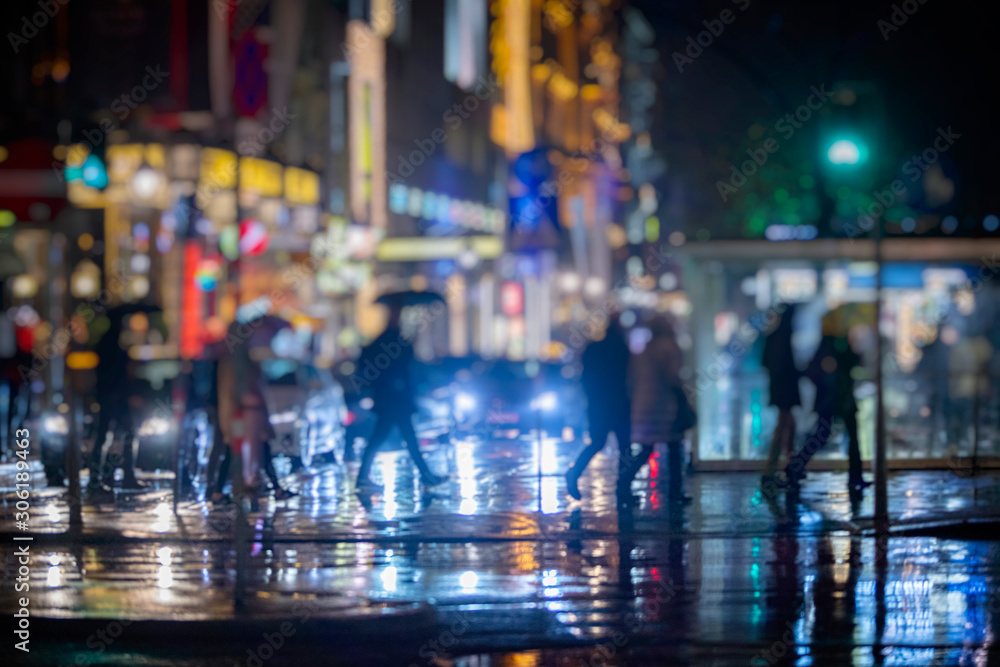 people walking on night street in the city people walking on night street in the city