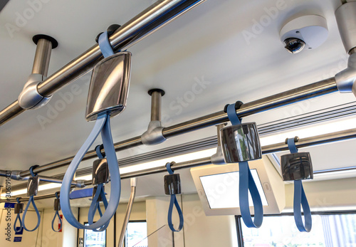 A Hand hold strap inside rapid transit train. photo