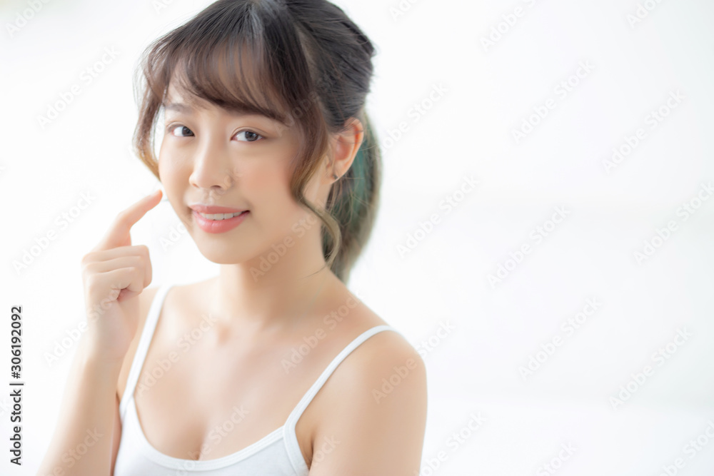 Portrait of beautiful young asian woman smile while wake up healthy and wellness with sunrise at morning in the bedroom, asia girl skin care with happy with fresh, lifestyle and relax concept. Portrait of beautiful young asian woman smile while wake up healthy and wellness with sunrise at morning in the bedroom, asia girl skin care with happy with fresh, lifestyle and relax concept.