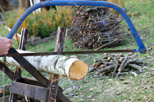 Detail of a wood sawing traditionally in the village