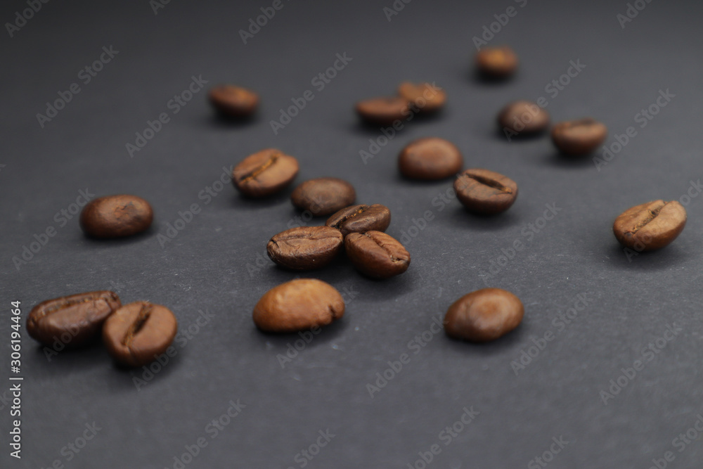 little man with coffee. grain on a dark background. little man with coffee. grain on a dark background.