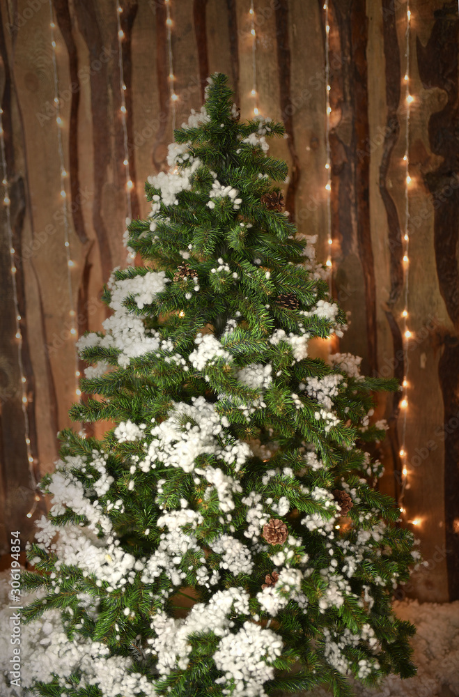 Fototapeta premium Decorative artificial christmas trees in the store