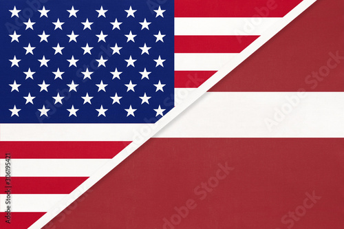 USA vs Latvia national flag from textile. Relationship between american and european countries.