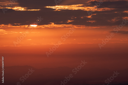 Fototapeta Naklejka Na Ścianę i Meble -  Sun rose into the clouds during morning
