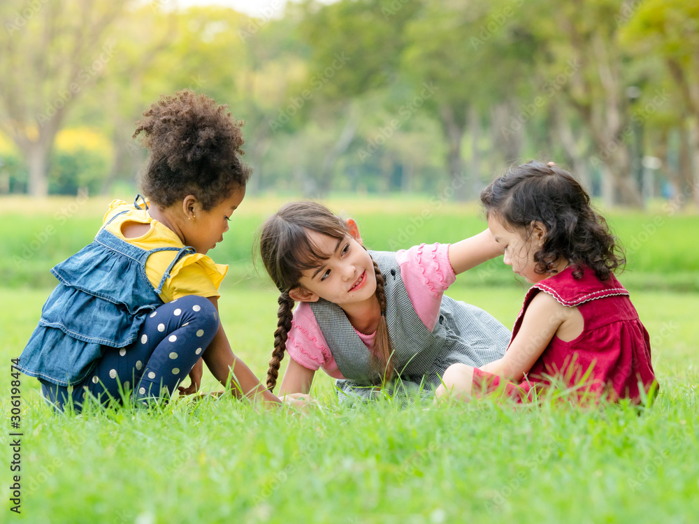 A group of young children of many nationalities play and learn outside of school A group of young children of many nationalities play and learn outside of school