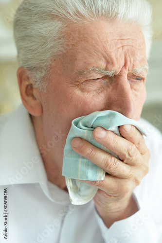 Close up portrait of sad sick senior man