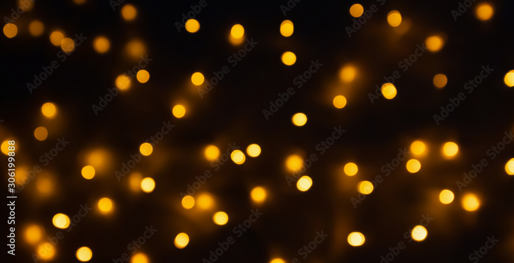 abstract golden bokeh light festive holiday on black background