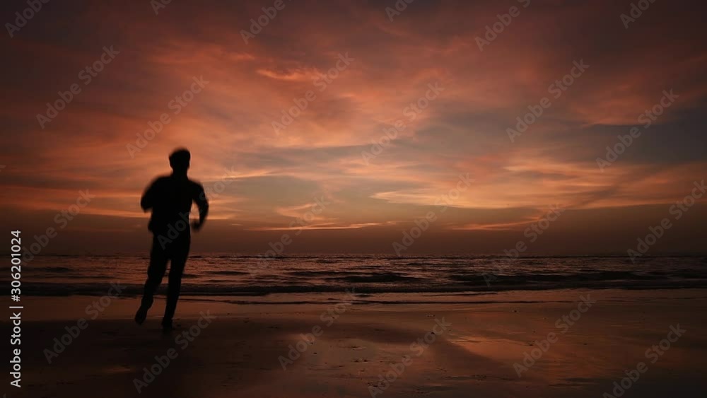 Man Running In Beach And Relaxing Man Running In Beach And Relaxing