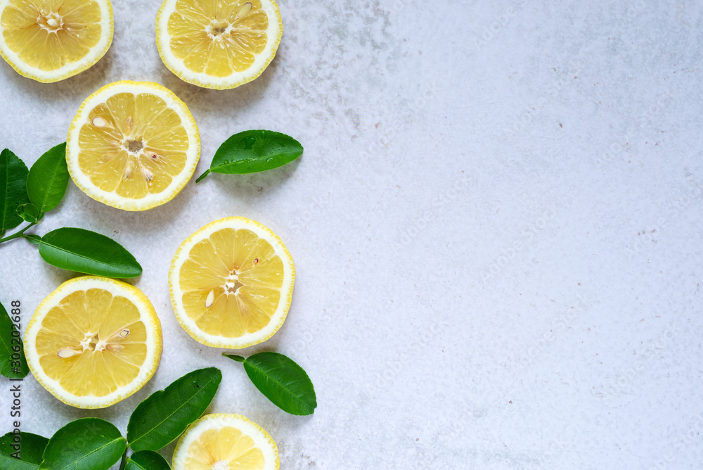 sliced fresh lemon with green leaves sliced fresh lemon with green leaves