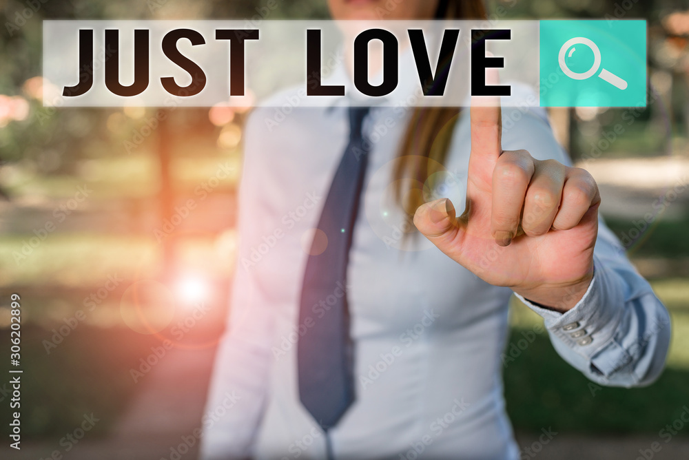 Writing note showing Just Love. Business concept for being interested physically in someone An emotional attachment Handsome business girl pointing with finger into empty space Writing note showing Just Love. Business concept for being interested physically in someone An emotional attachment Handsome business girl pointing with finger into empty space