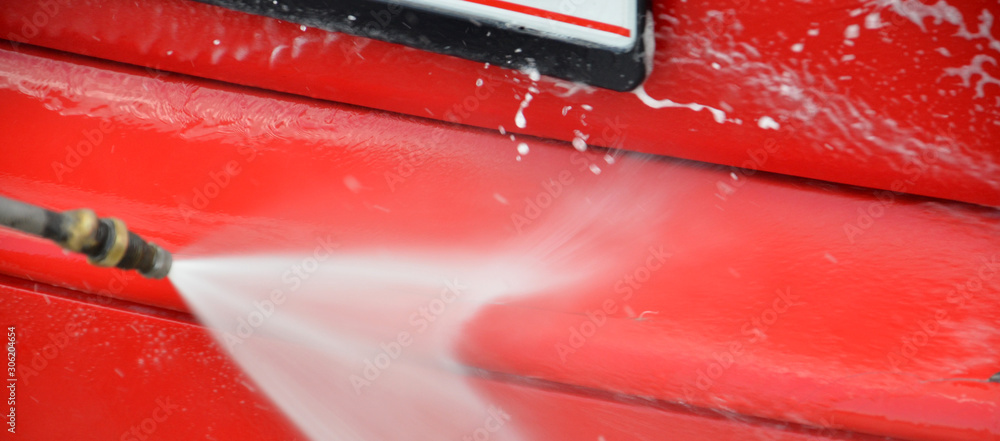 washing red car outdoor