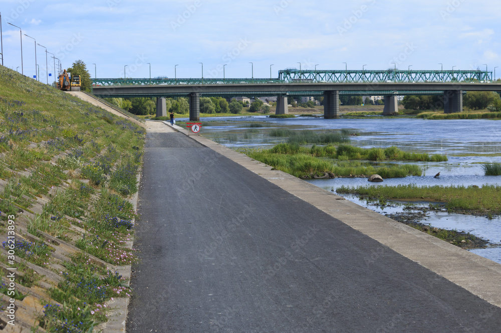 Naklejka premium Walking area along the suburban river.