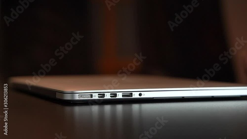 Man closes laptop in the office