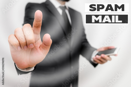 Word writing text Spam Mail. Business photo showcasing Intrusive advertising Inappropriate messages sent on the Internet Male human wear formal work suit hold smart hi tech smartphone use one hand
