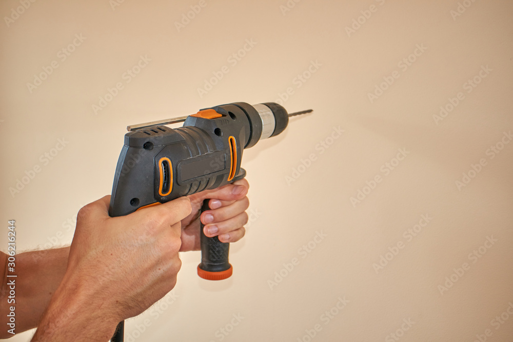 Man making hole with drill