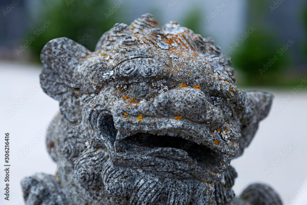 Chinese stone figure in close-up, looks like some kind of demon