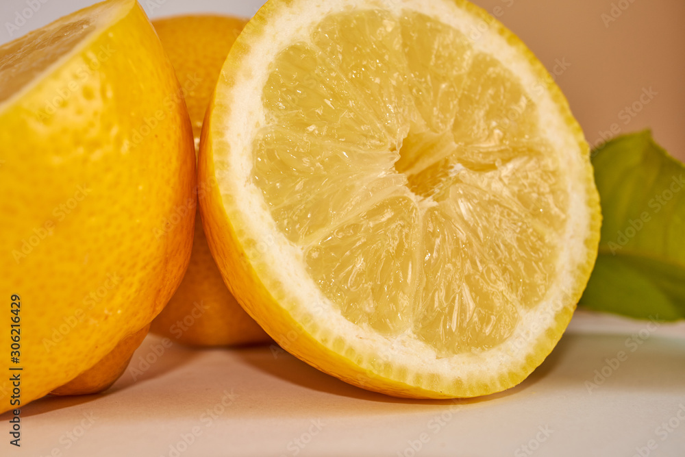 lemons cut with lemon leaves lemons cut with lemon leaves