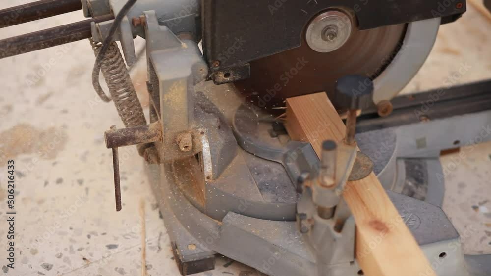 Carpenter Using Circular Saw.The worker makes a cut on a circular saw. Carpenter Using Circular Saw.The worker makes a cut on a circular saw.