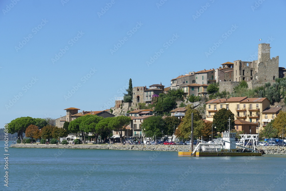 Passignano on Trasimeno Lake panorama from the port of the village built on a rocky spur around a Lombard fortification.
