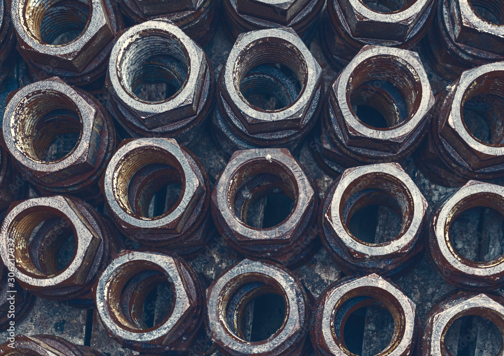 modern background of rusty old steel nuts modern background of rusty old steel nuts