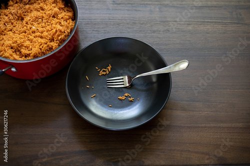 Empty plate of jollof rice photo