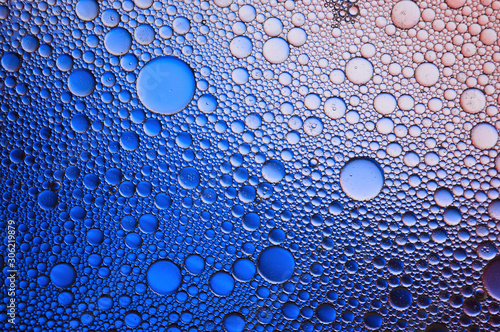 Background of colorful oil drops in water surface - abstraction