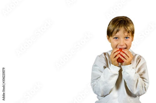 little girl eating fruit isolated on white background