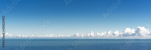 Fotografie, Tablou Sea. Sea horizon and clouds in the distance on a clear day.