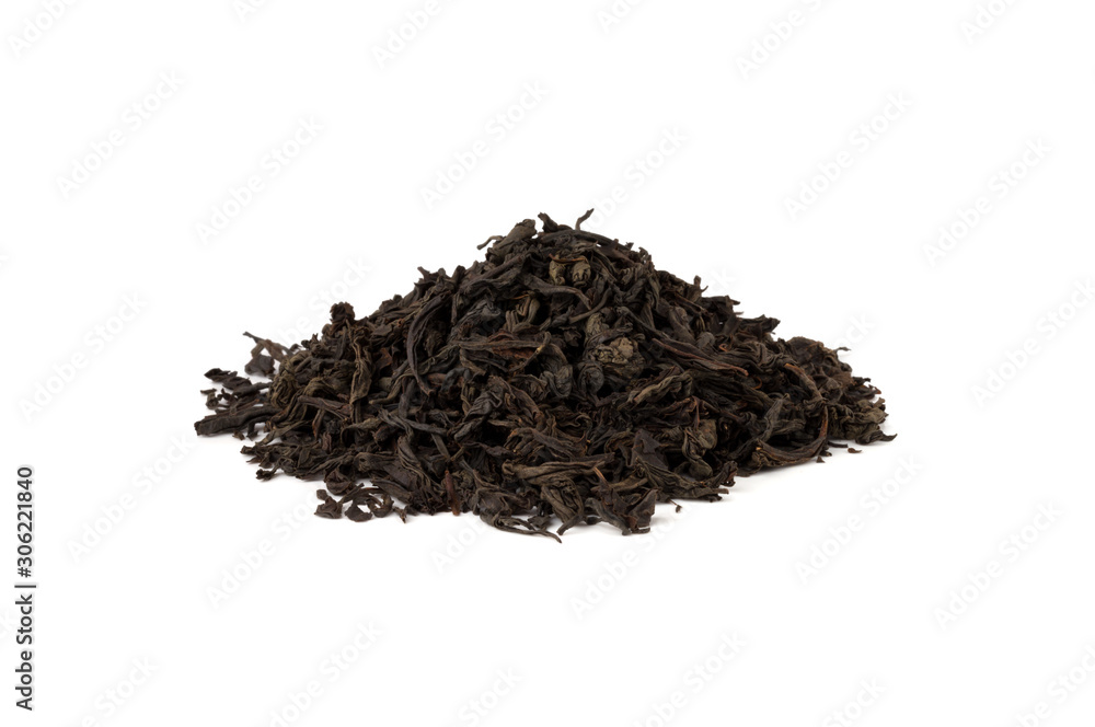 Black tea on a white background. A pile of dried tea leaves on a white background. Black tea on a white background. A pile of dried tea leaves on a white background.