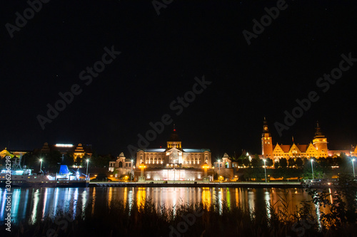 Historic buildings at night. View across the Odra River in Szczecin