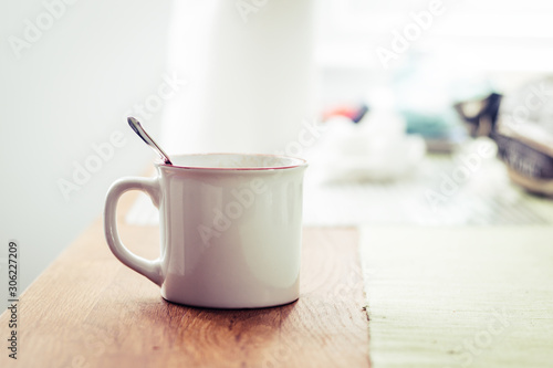 white cup of breakfast on wooden table