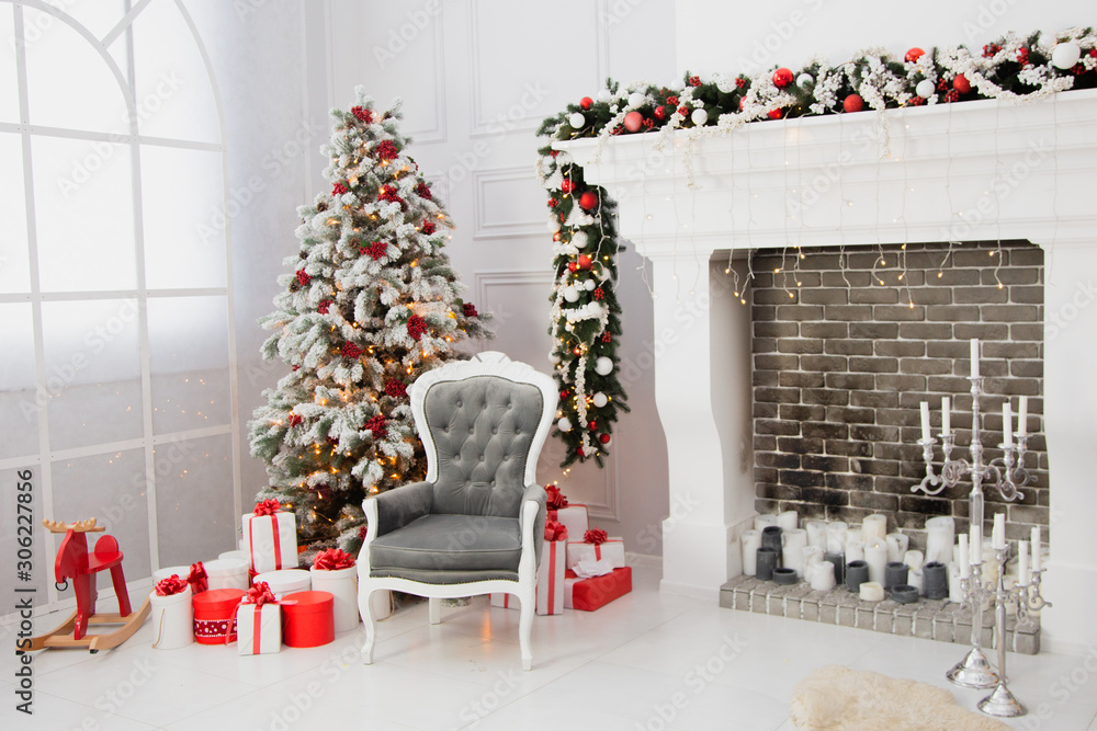 Christmas decor and a tree by the fireplace