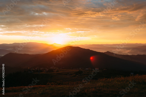 Wallpaper Mural Sunbeams at dawn in the mountains, light fog over the hills Torontodigital.ca