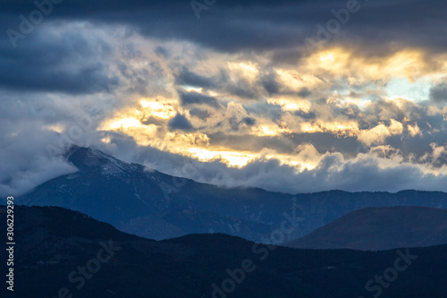 tormented sky during sunset in the mountains