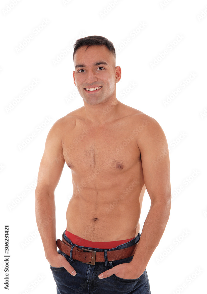 Fototapeta premium Shirtless man standing in jeans and smiling