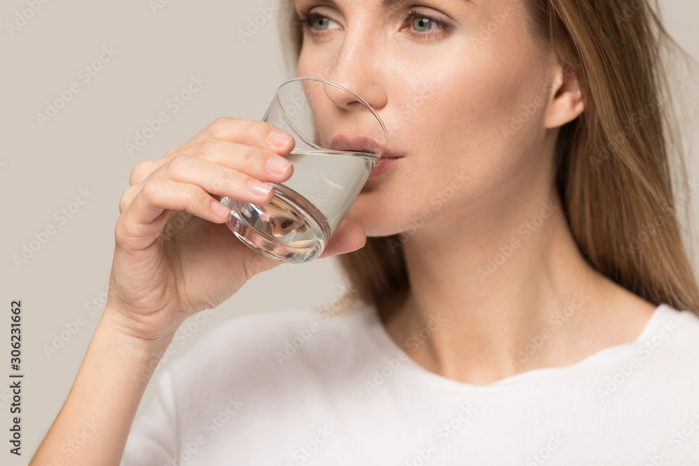 Healthy thirsty beautiful woman drinking clean mineral water Healthy thirsty beautiful woman drinking clean mineral water