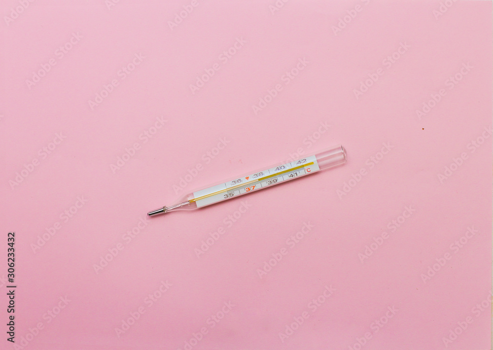 mercury thermometer on a pink background mercury thermometer on a pink background