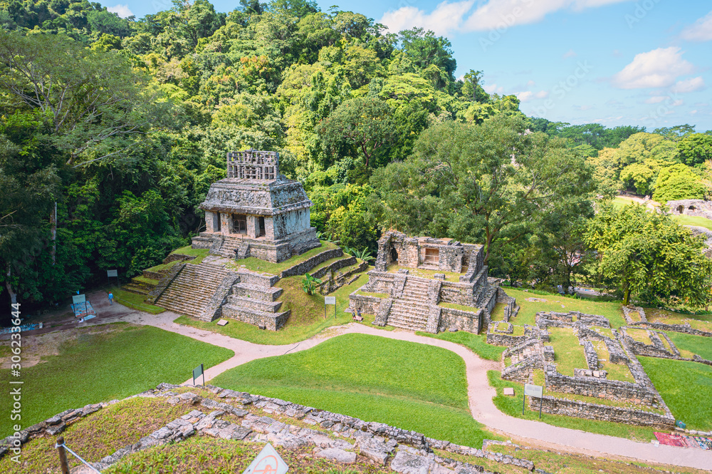 Ancient Mayan ruins in Palenque, Chiapas, Mexico. Mayan ruins in the middle of the jungle on a sunny day.